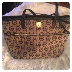 Brown and black Michael Kors purse